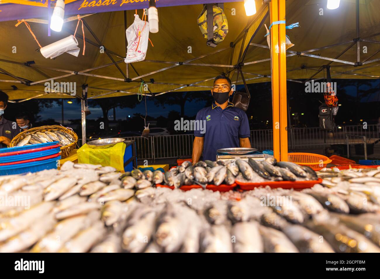 Street food night market at Putrajaya, near Kuala Lumpur. Salesman with