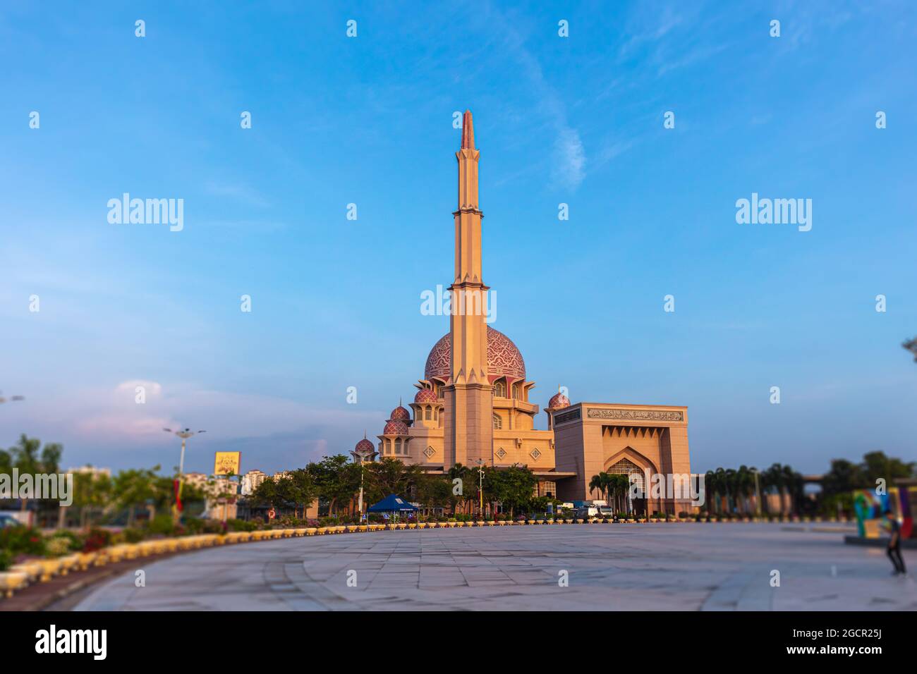 The city sign of the city of Putrajaya, Malaysia, in the color of the Malaysian flag. In the background the Putra Mosque or Masjid Putra, principal mo Stock Photo