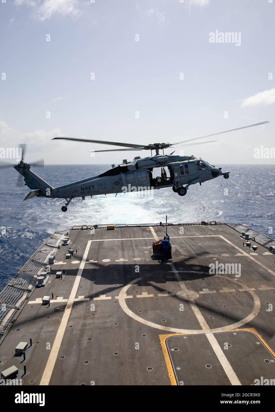 210721-N-RL695-1241   CARIBBEAN SEA - (July 21, 2021) -- An MH-60S Seahawk helicopter attached to the “Sea Knights” of Helicopter Sea Combat Squadron (HSC) 22, Detachment 3, takes off from the flight deck of the Freedom-variant littoral combat ship USS Sioux City (LCS 11) to transfer of 575 kilograms of suspected contraband to the Freedom-variant littoral combat ship USS Billings (LCS 15), July 21, 2021. Sioux City is deployed to the U.S. 4th Fleet area of operations to support Joint Interagency Task Force South’s mission, which includes counter-illicit drug trafficking missions in the Caribbe Stock Photo