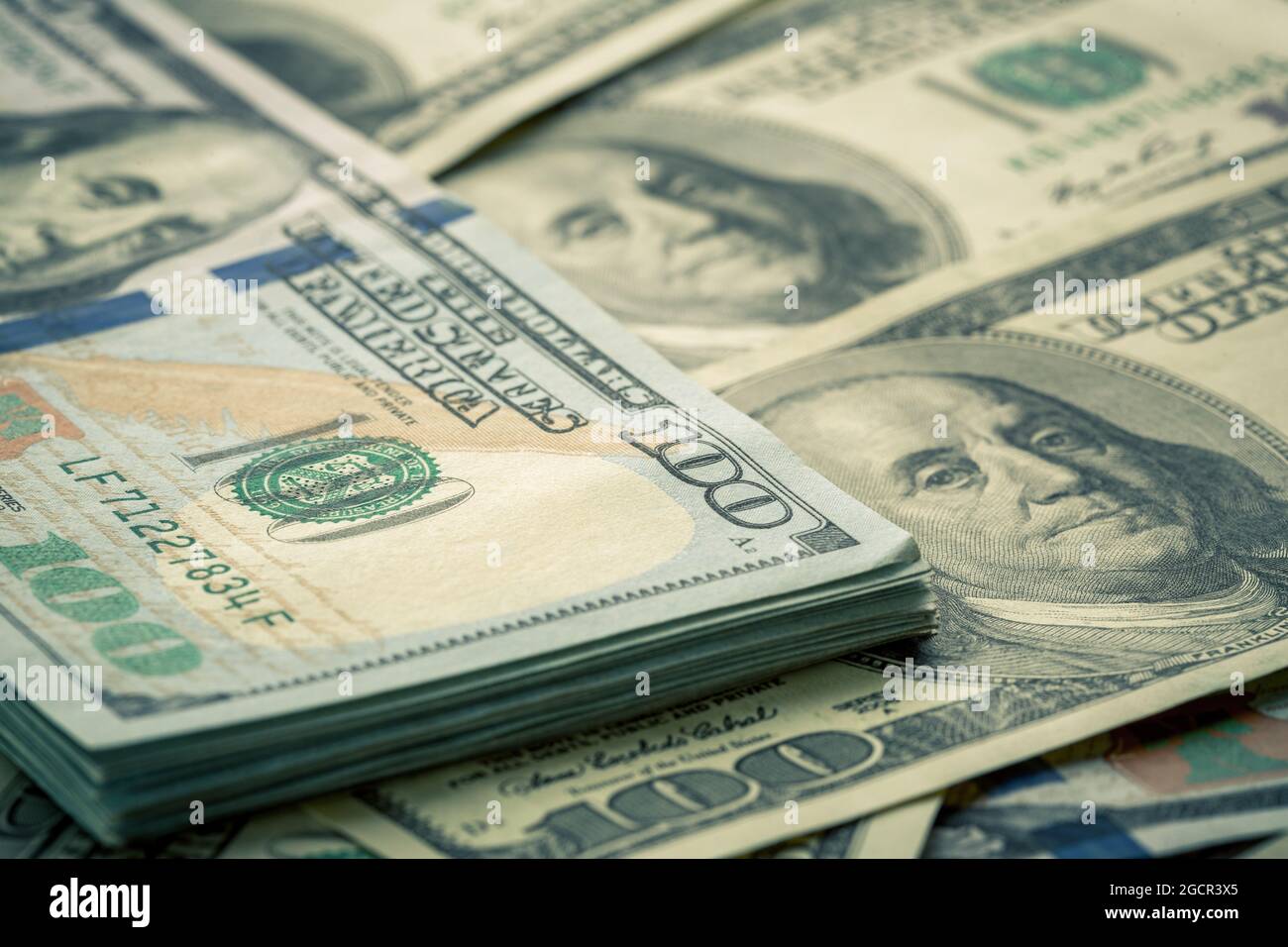 Lot of one hundred dollar bills close-up background Stock Photo - Alamy