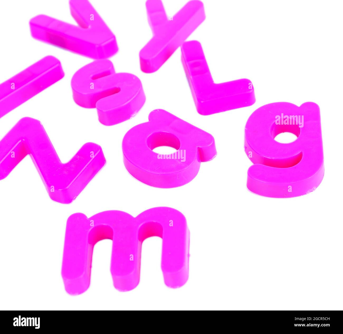 Colorful magnetic letters isolated on white Stock Photo - Alamy