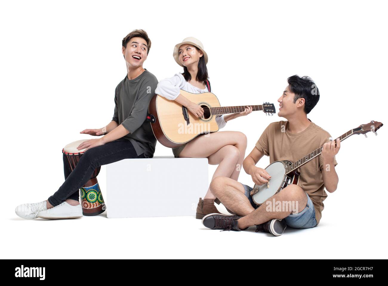 Young people playing musical instrument Stock Photo - Alamy