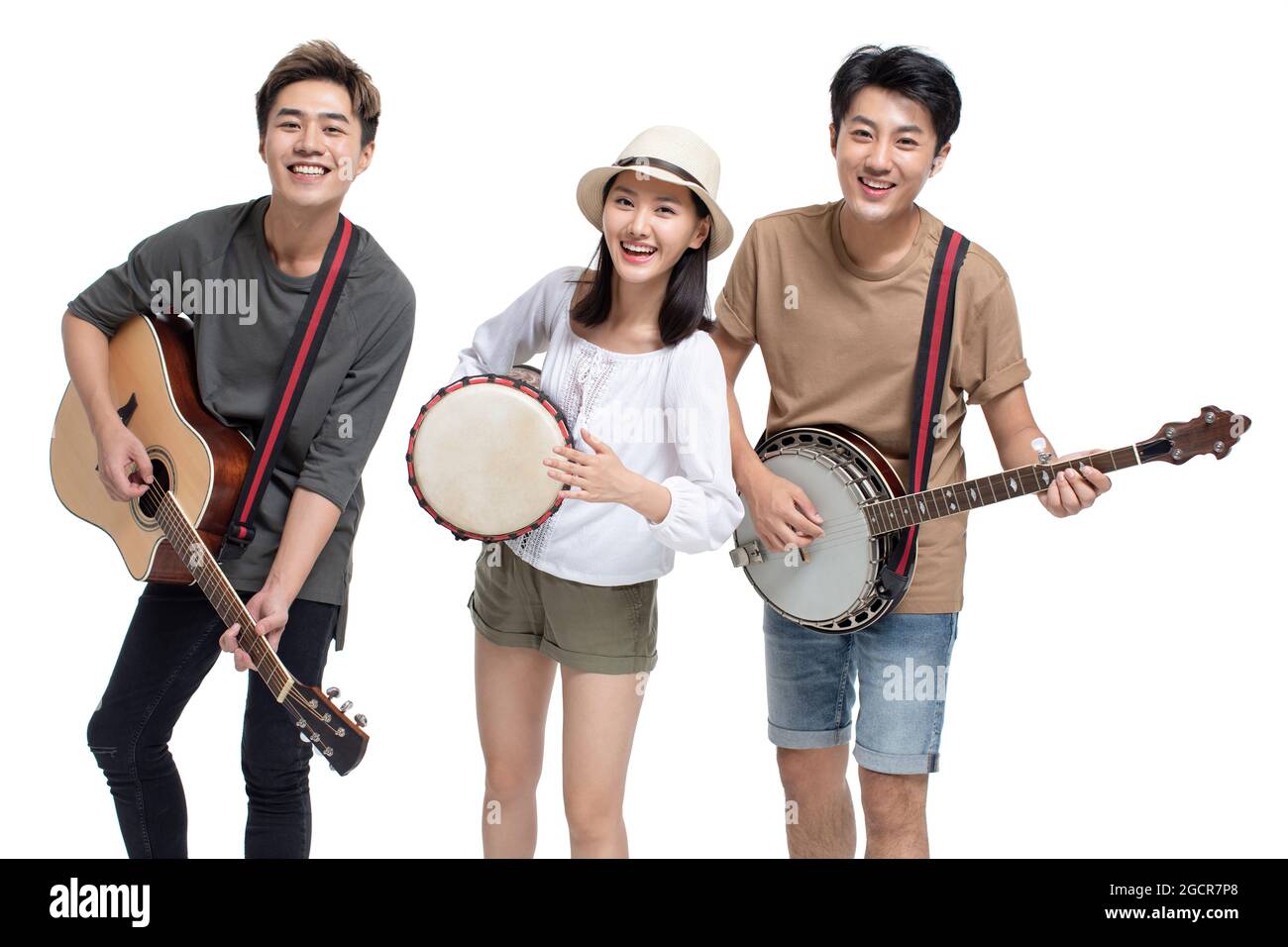 Young people playing musical instrument Stock Photo - Alamy