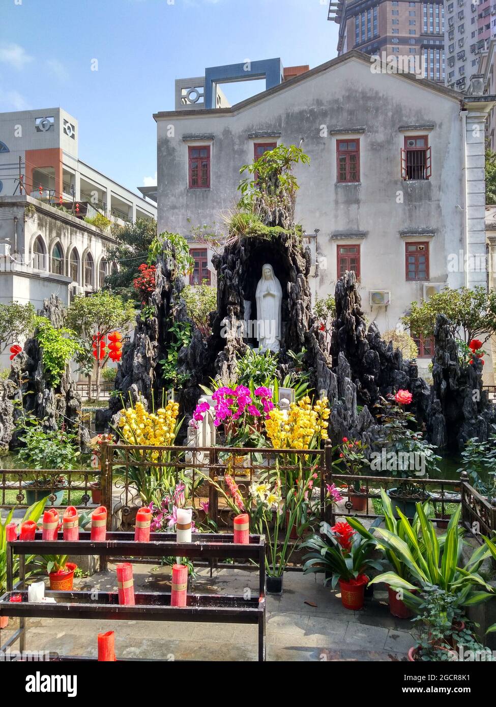 The beautiful garden at the Sacred Heart Cathedral in Guangzhou featuring the Virgin Mary Stock Photo