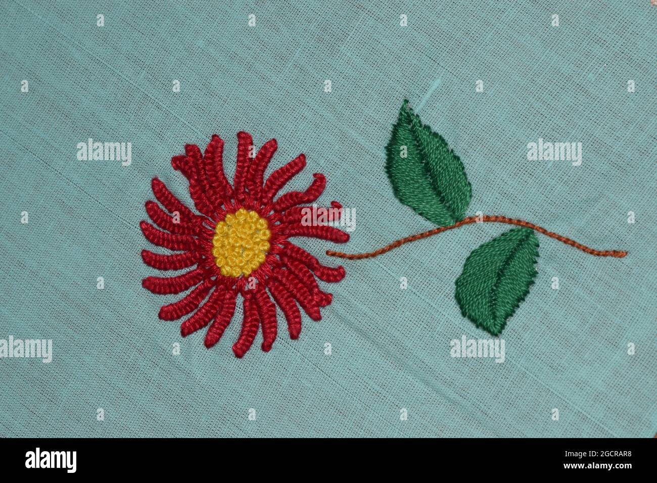 Hand embroider flower design in textile fabric Stock Photo