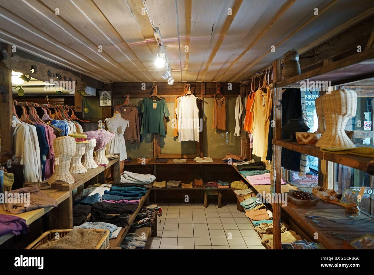 Interior design and decoration of displayed fabric goods, clothing and  accessories store Stock Photo - Alamy