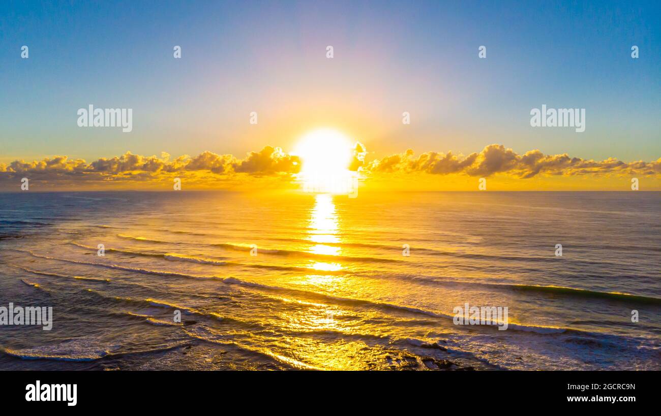 Sun rise at the beach of village of Yeppoon, Queensland, Australia. At ...