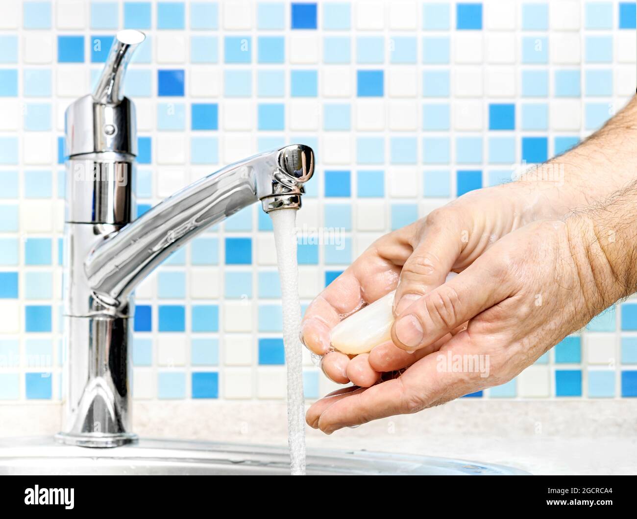 Washing of hands with soap under running water Stock Photo - Alamy