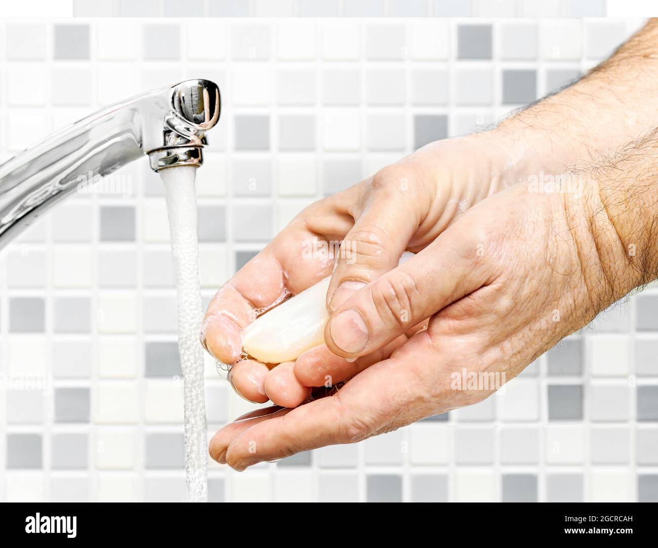 Washing of hands with soap under running water close-up Stock Photo - Alamy