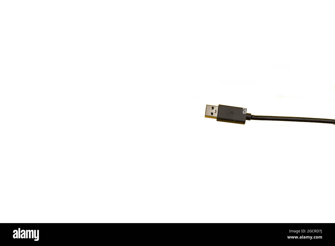 An USB cable with a white backgfround and a space for text on the left Stock Photo