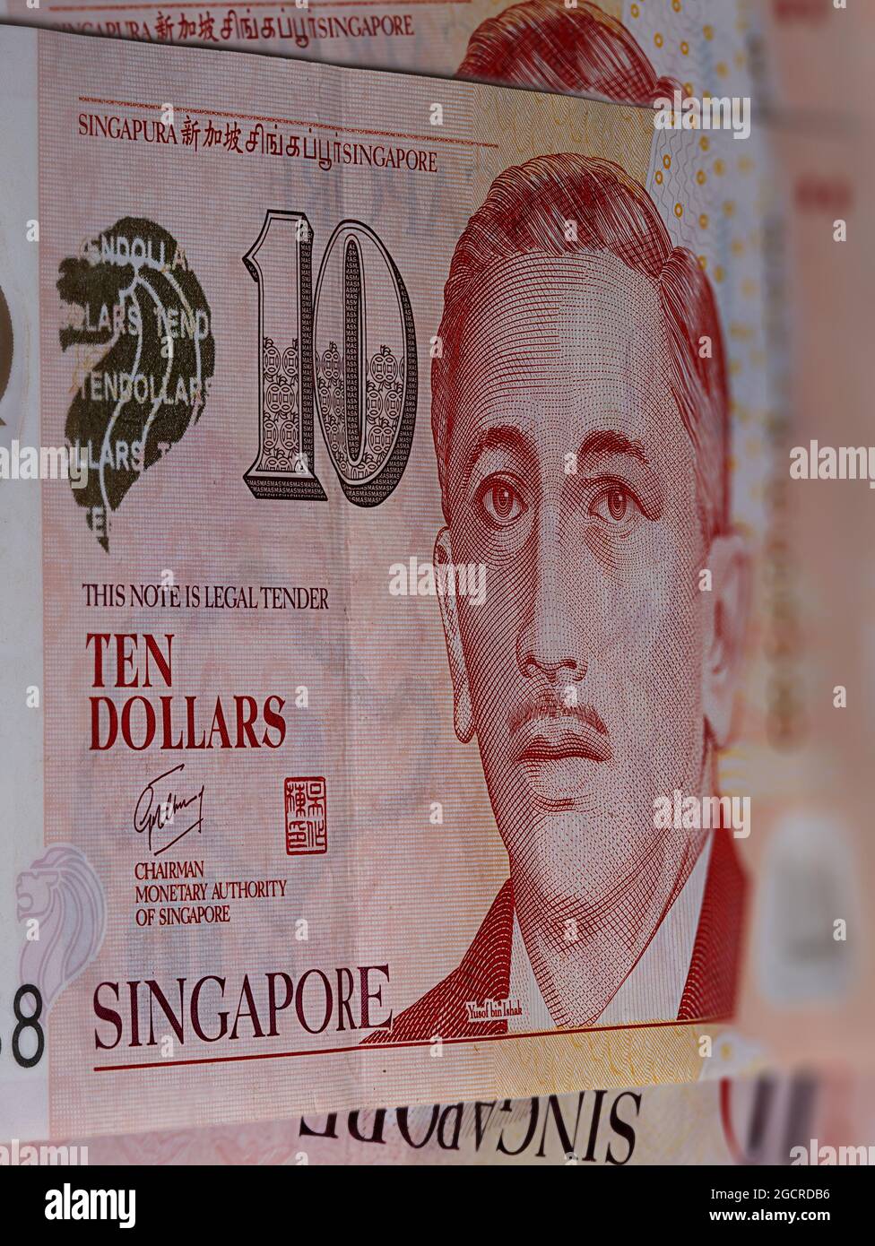 Close up of 10 Singapore dollars. Currency of the City-state of Singapore. Bunch of two Singaporean Dollars. Plastic money with the portrait of Presid Stock Photo