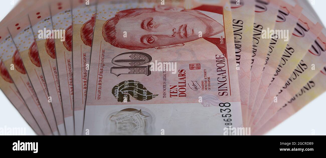 Close up of 10 Singapore dollars. Currency of the City-state of Singapore. Bunch of two Singaporean Dollars. Plastic money with the portrait of Presid Stock Photo