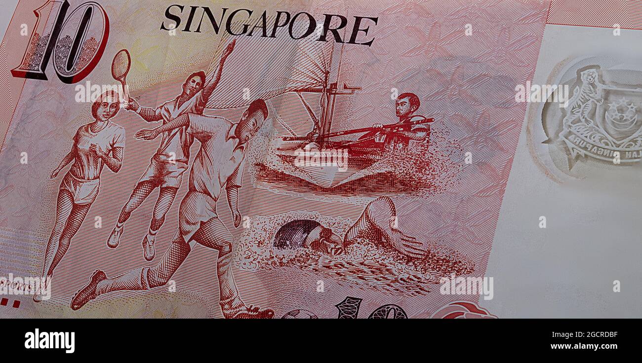 Reverse side of 10 Singapore dollar. Currency of the City-state of Singapore. Close up of ten Singaporean Dollars. Polymer money with the sport motive Stock Photo