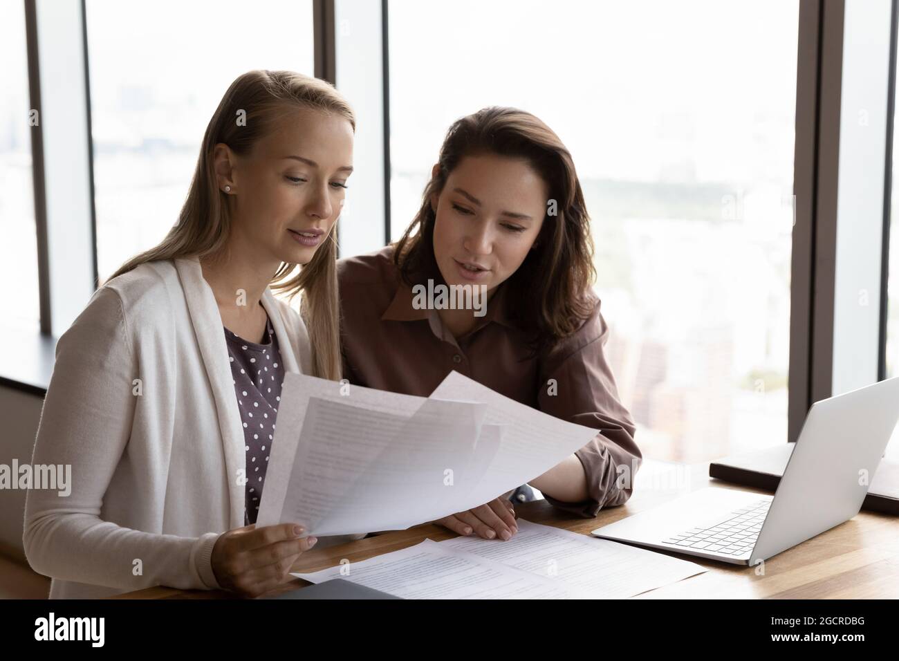 Corporate leader training new employee. Mentor showing company to intern Stock Photo