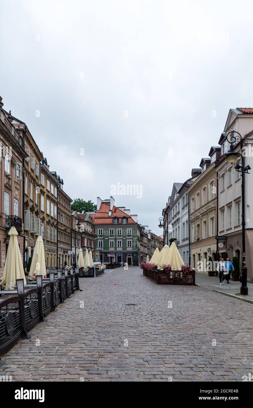 Warsaw, Masovia, Poland - July 4, 2021: Street amidst buildings in city. Stock Photo