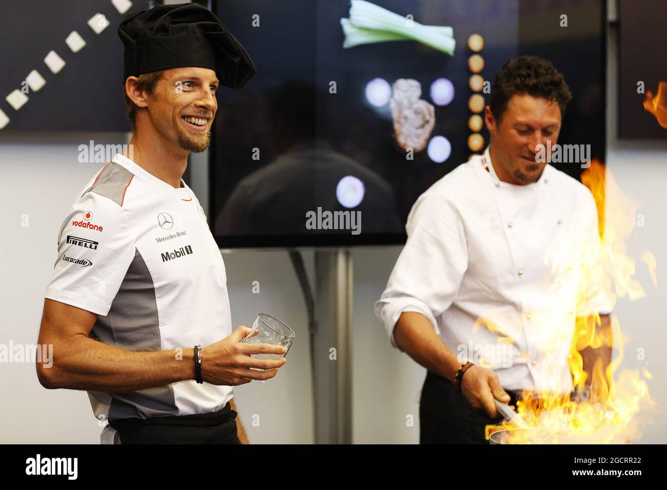 Jenson Button (GBR) McLaren at a Pirelli cooking competition. 23.05.2012. Formula 1 World Championship, Rd 6, Monaco Grand Prix, Monte Carlo, Monaco, Preparation Day Stock Photo