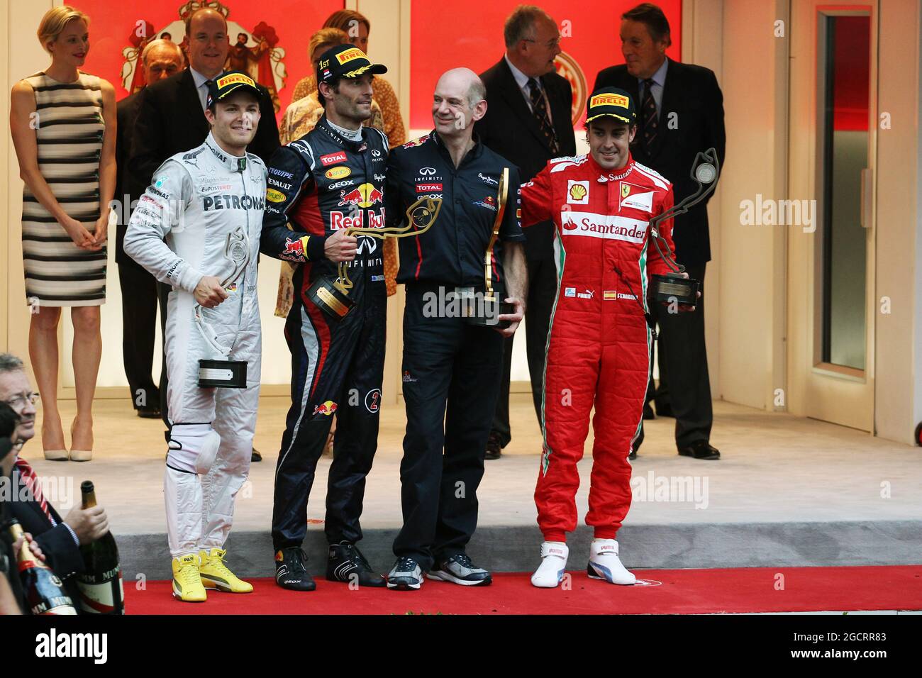 The podium (L to R): Nico Rosberg (GER) Mercedes AMG F1, second; Mark Webber  (AUS) Red Bull Racing, race winner; Adrian Newey (GBR) Red Bull Racing  Chief Technical Officer; Fernando Alonso (ESP)