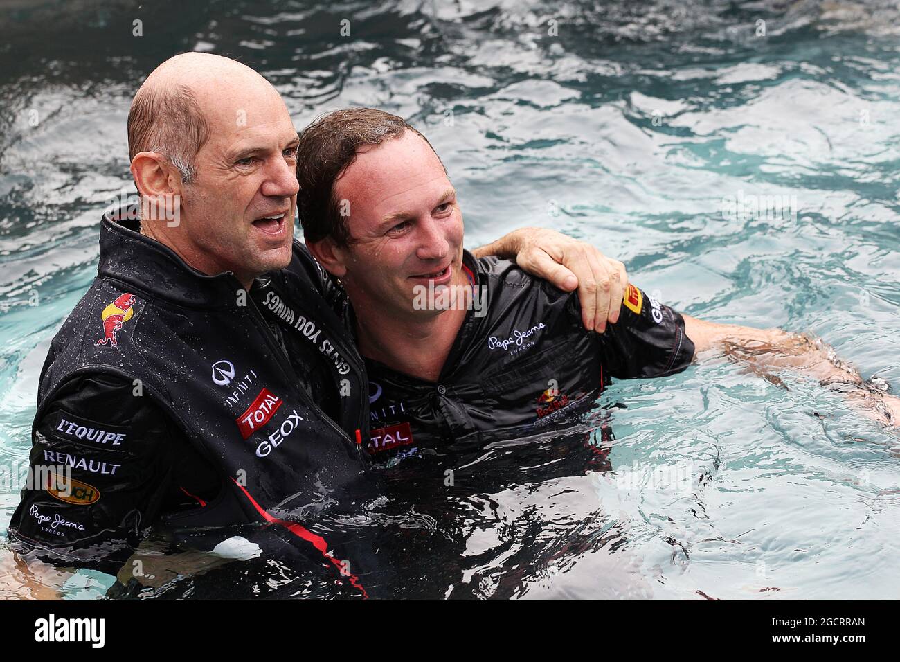 (L to R): Adrian Newey (GBR) Red Bull Racing Chief Technical Officer and Christian Horner (GBR) Red Bull Racing Team Principal celebrate the victory of Mark Webber (AUS) Red Bull Racing on the Red Bull Energy Station. Monaco Grand Prix, Sunday 27th May 2012. Monte Carlo, Monaco. Stock Photo