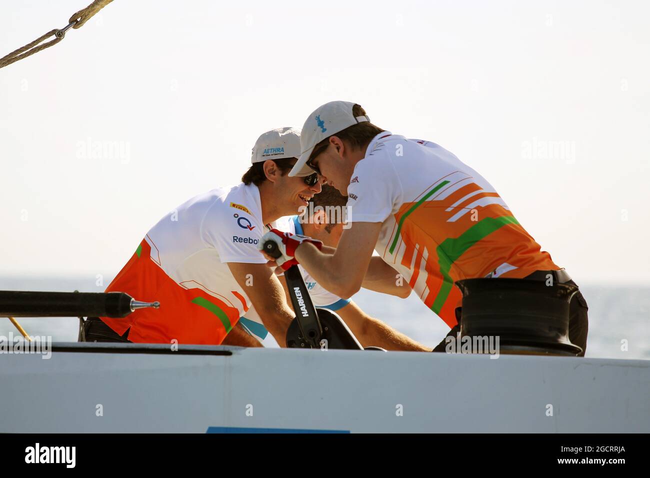 Nico Hulkenberg (GER) Sahara Force India F1 (Right) and Jules Bianchi (FRA) Sahara Force India F1 Team Third Driver on the Aethra America's Cup Boat. European Grand Prix, Thursday 21st June 2012. Valencia, Spain. Stock Photo