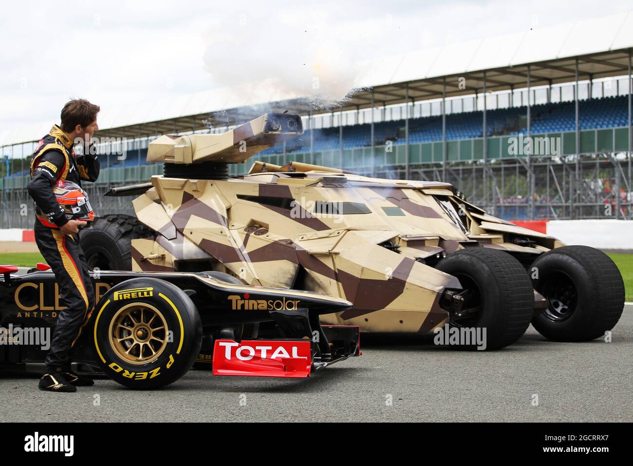 Romain Grosjean (FRA) Lotus F1 E20 with the Tumbler vehicle from the ...