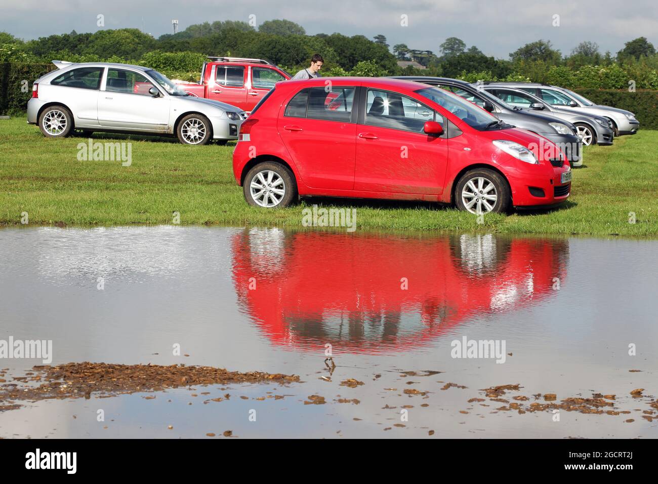 Wet and muddy car parks and camp sites at the circuit. British Grand Prix, Friday 6th July 2012. Silverstone, England. Stock Photo