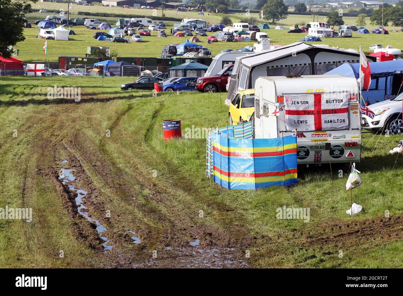 Wet and muddy car parks and camp sites at the circuit. British Grand Prix, Friday 6th July 2012. Silverstone, England. Stock Photo