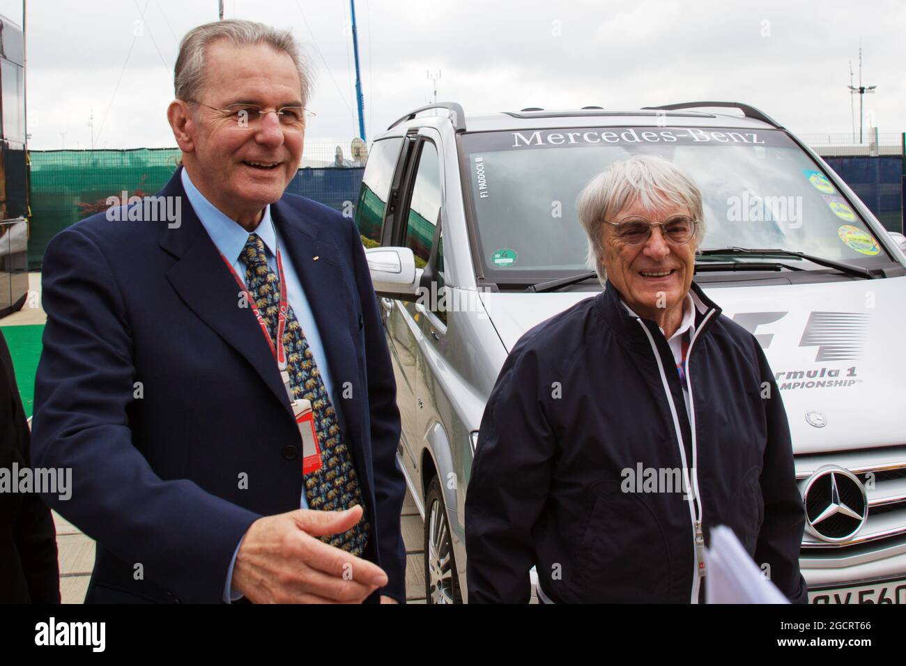 (L to R): Jacques Rogge (FRA) IOC President with Bernie Ecclestone (GBR) CEO Formula One Group (FOM). British Grand Prix, Sunday 8th July 2012. Silverstone, England. Stock Photo