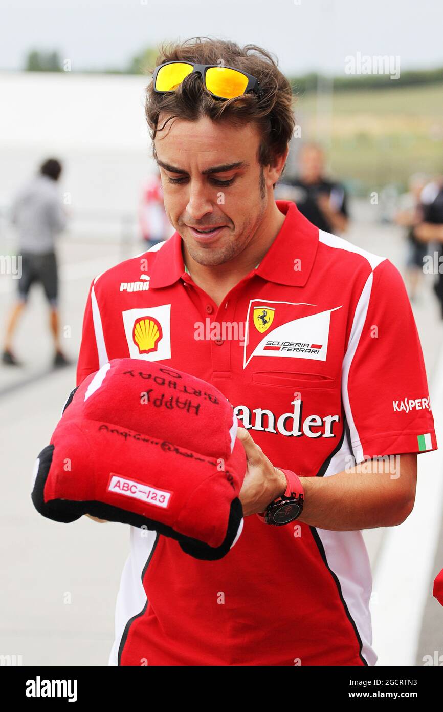 Fernando Alonso (ESP) Ferrari with an early birthday present. Hungarian Grand Prix, Thursday 26th July 2012. Budapest, Hungary. Stock Photo
