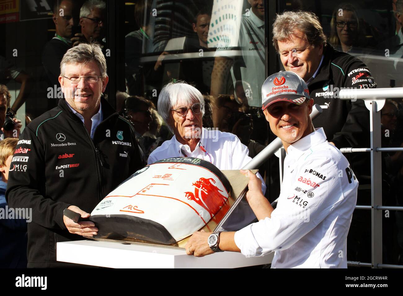 Michael Schumacher (GER) Mercedes AMG F1 celebrates his 300th GP with Ross Brawn (GBR) Mercedes AMG F1 Team Principal; Bernie Ecclestone (GBR) CEO Formula One Group (FOM) and Norbert Haug (GER) Mercedes Sporting Director. Belgian Grand Prix, Saturday 1st September 2012. Spa-Francorchamps, Belgium. Stock Photo