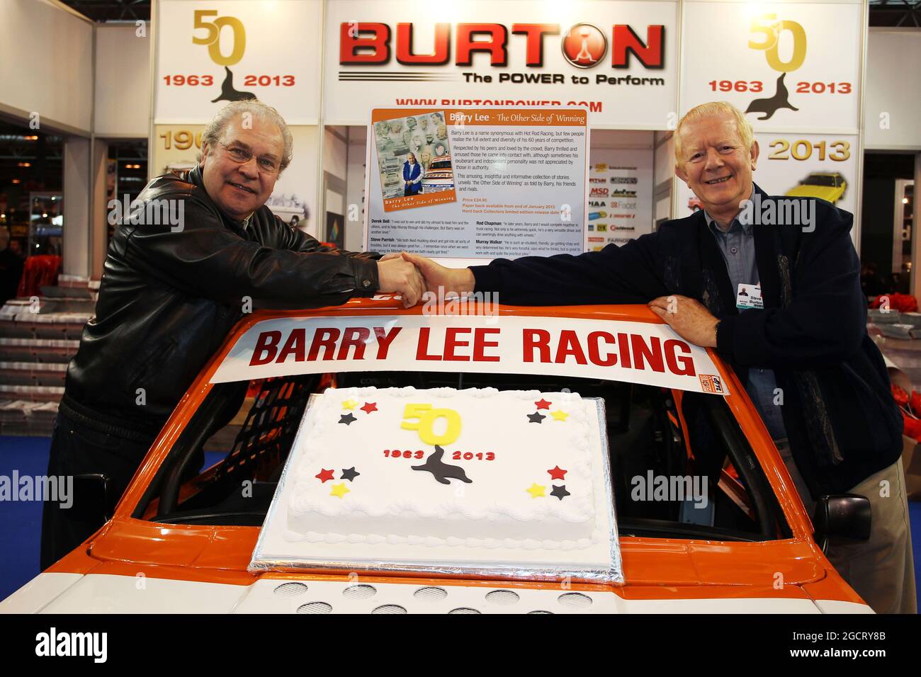 Barry Lee (GBR) (Left) celebrates 50 years of racing at the Burton stand.  Autosport International, Thursday 10th January 2013. National Exhibition  Centre, Birmingham, England Stock Photo - Alamy