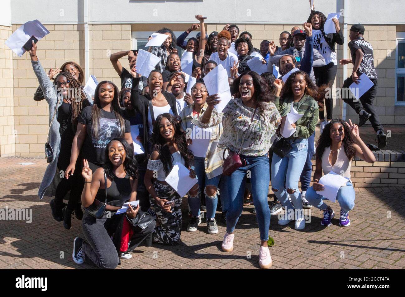 Students celebrate at Brampton Manor Academy in London, as they receive their A-Level results. Picture date: Tuesday August 10, 2021. Stock Photo
