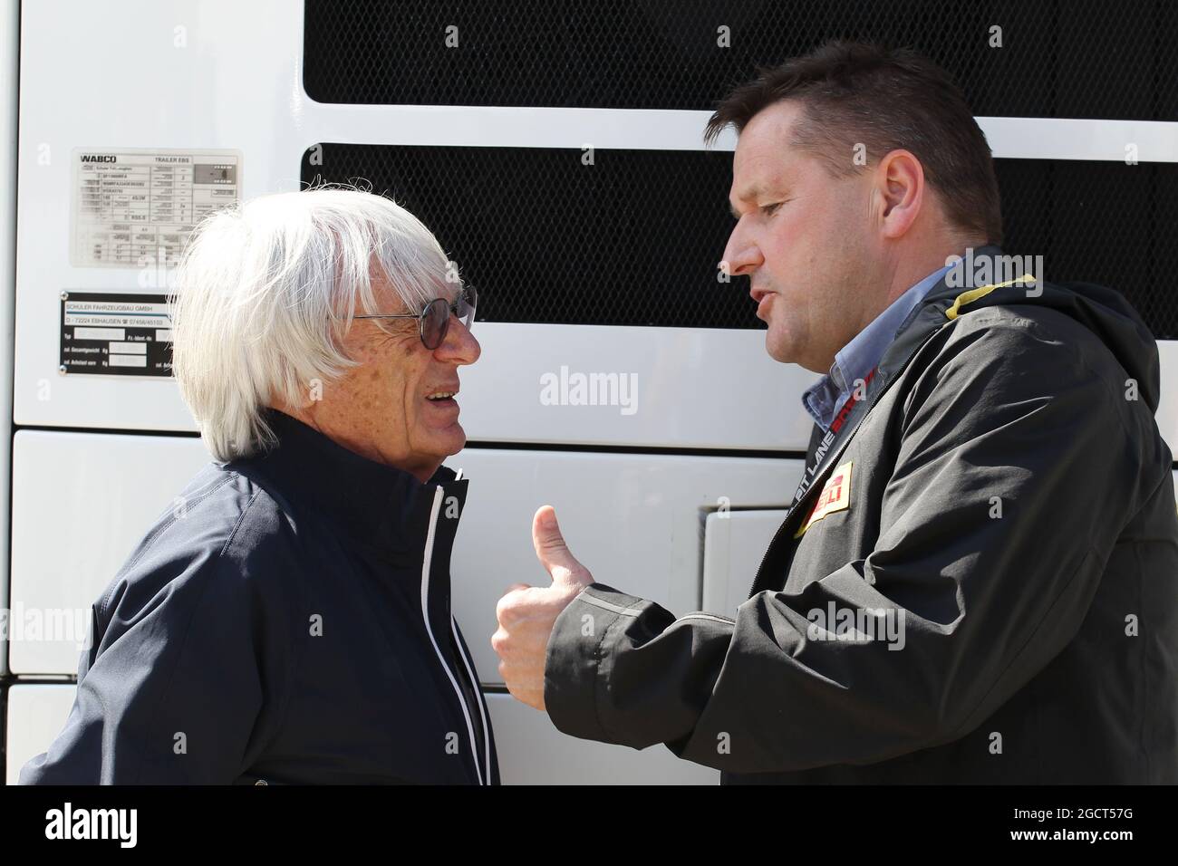 (L to R): Bernie Ecclestone (GBR) CEO Formula One Group (FOM) with Paul Hembery (GBR) Pirelli Motorsport Director. British Grand Prix, Saturday 29th June 2013. Silverstone, England. Stock Photo