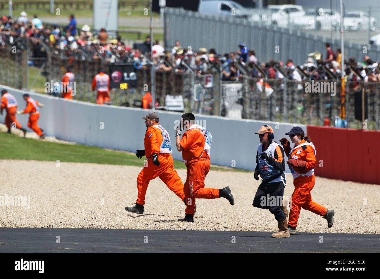 Marshals come on to track to remove debris from circuit hires stock photography and images Alamy