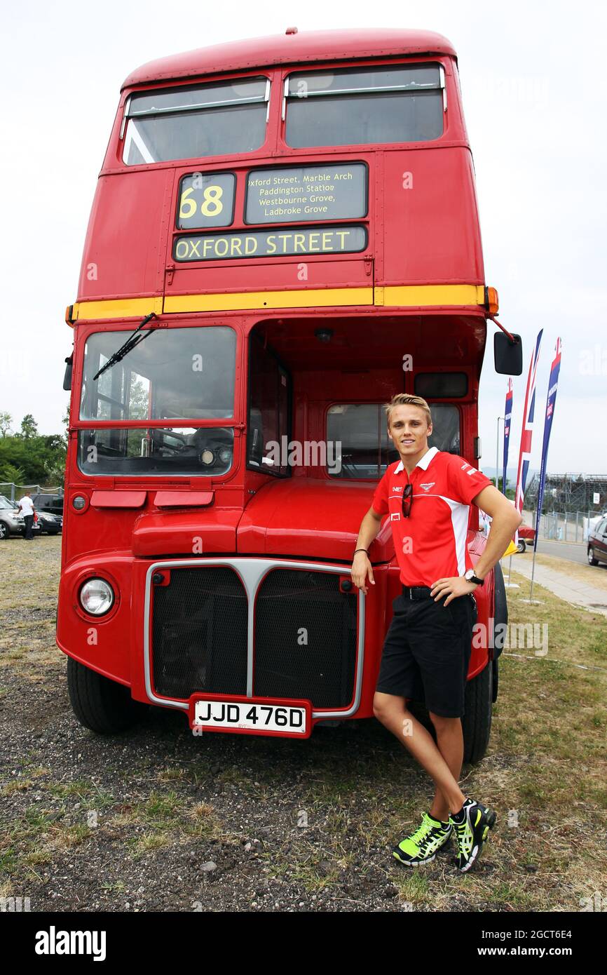 Max Chilton (GBR) Marussia F1 Team with a Routemaster Bus as part of a UK Trade and Investment initiative promoting British Business in Eastern Europe. Hungarian Grand Prix, Thursday 25th July 2013. Budapest, Hungary. Stock Photo