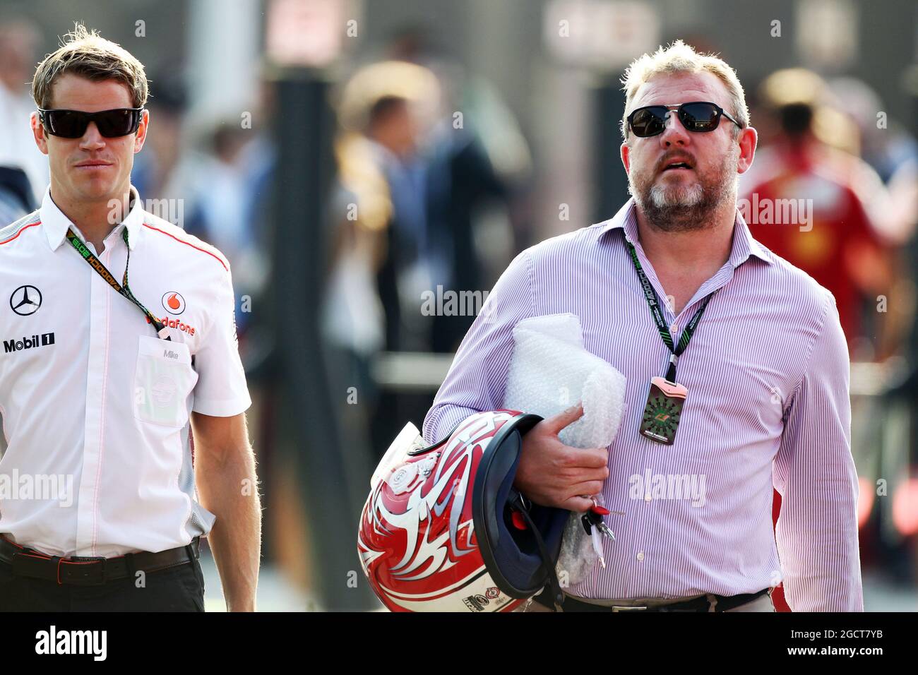 (L to R): Mike Collier (GBR) Personal Trainer of Jenson Button (GBR) McLaren with Richard Goddard (GBR) Driver Manager of Paul di Resta (GBR) Sahara Force India F1 and Jenson Button (GBR) McLaren. Italian Grand Prix, Saturday 7th September 2013. Monza Italy. Stock Photo
