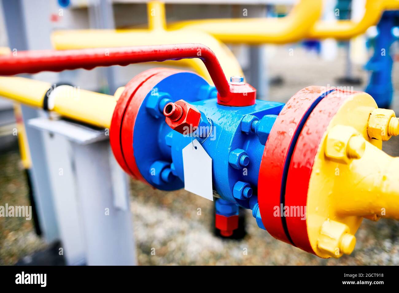Shut-off valve of the gas pipeline pipe close-up. Background on the topic of gasification and construction of the main gas pipeline. Stock Photo