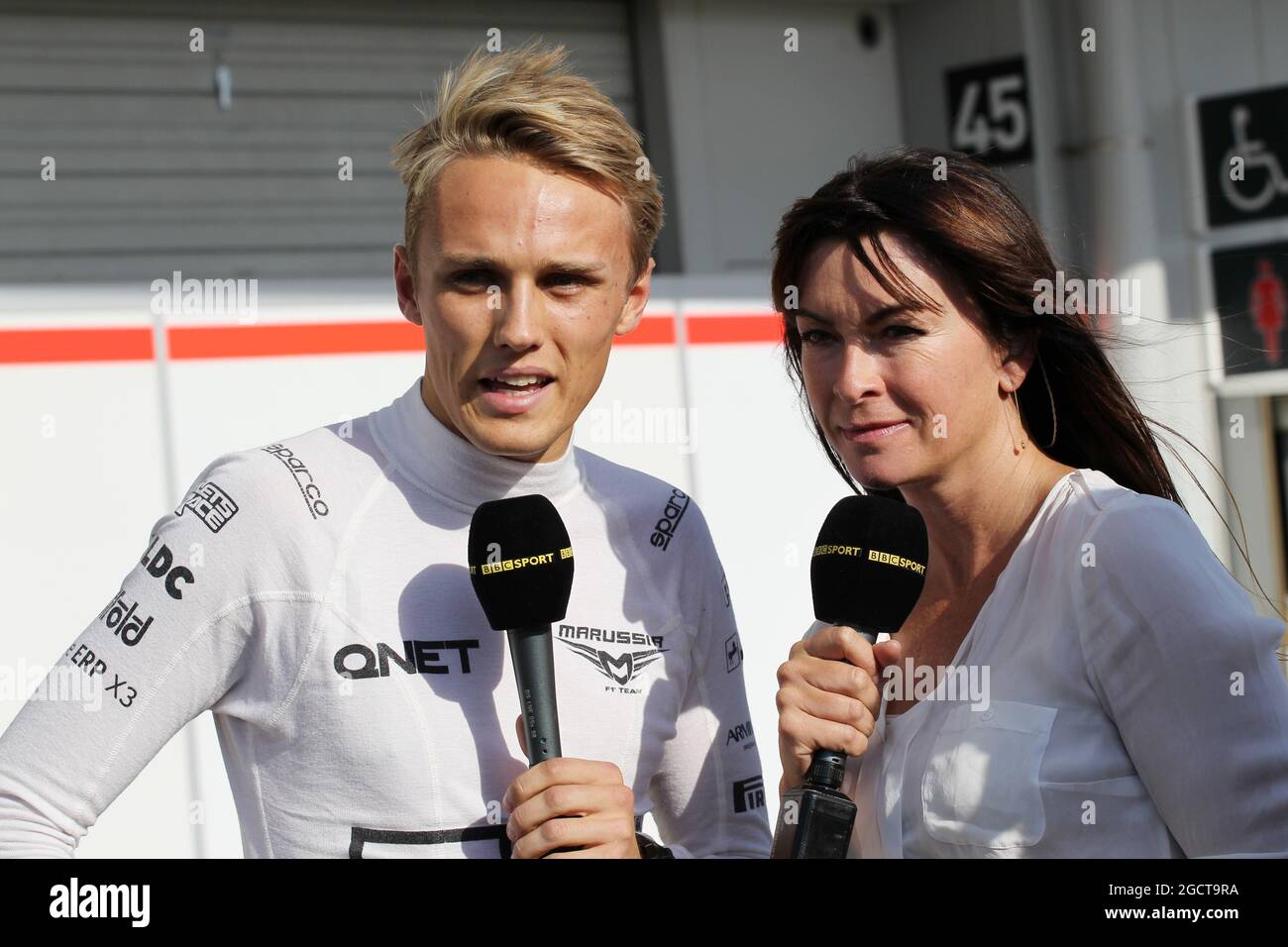 L to R) Max Chilton (GBR) Marussia F1 Team with Suzi Perry (GBR) BBC F1 Presenter