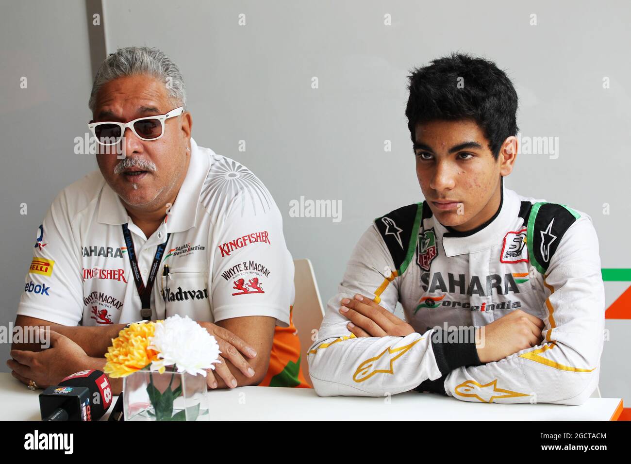Dr. Vijay Mallya (IND) Sahara Force India F1 Team Owner and Jehan Daruvala (IND) Sahara Force India Academy Driver, winner of the British KF3 Karting Championship, with the media. Indian Grand Prix, Saturday 26th October 2013. Greater Noida, New Delhi, India. Stock Photo