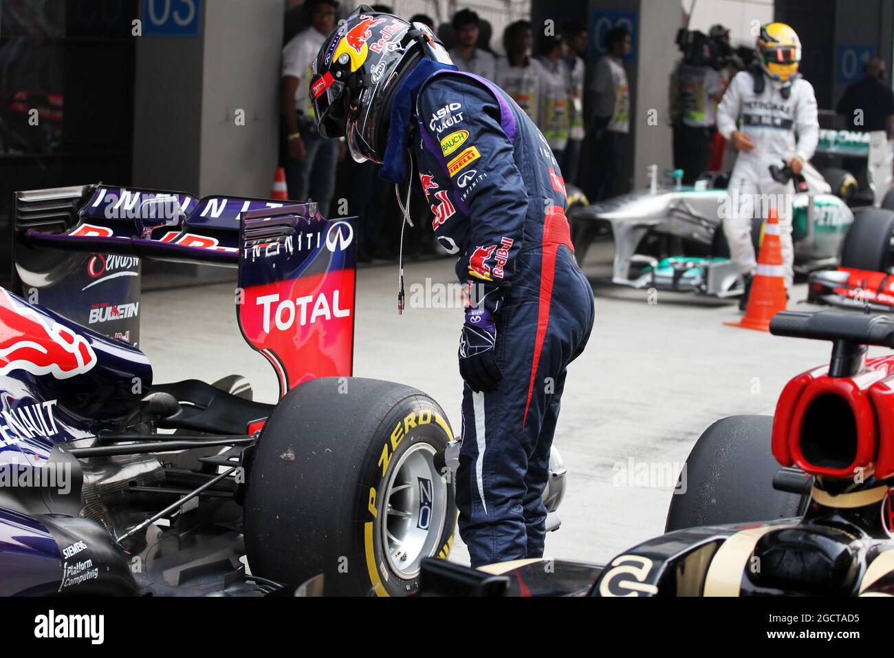 Pole sitter Sebastian Vettel (GER) Red Bull Racing uses a fan to cool the brakes on his Red Bull Racing RB9. Indian Grand Prix, Saturday 26th October 2013. Greater Noida, New Delhi, India. Stock Photo