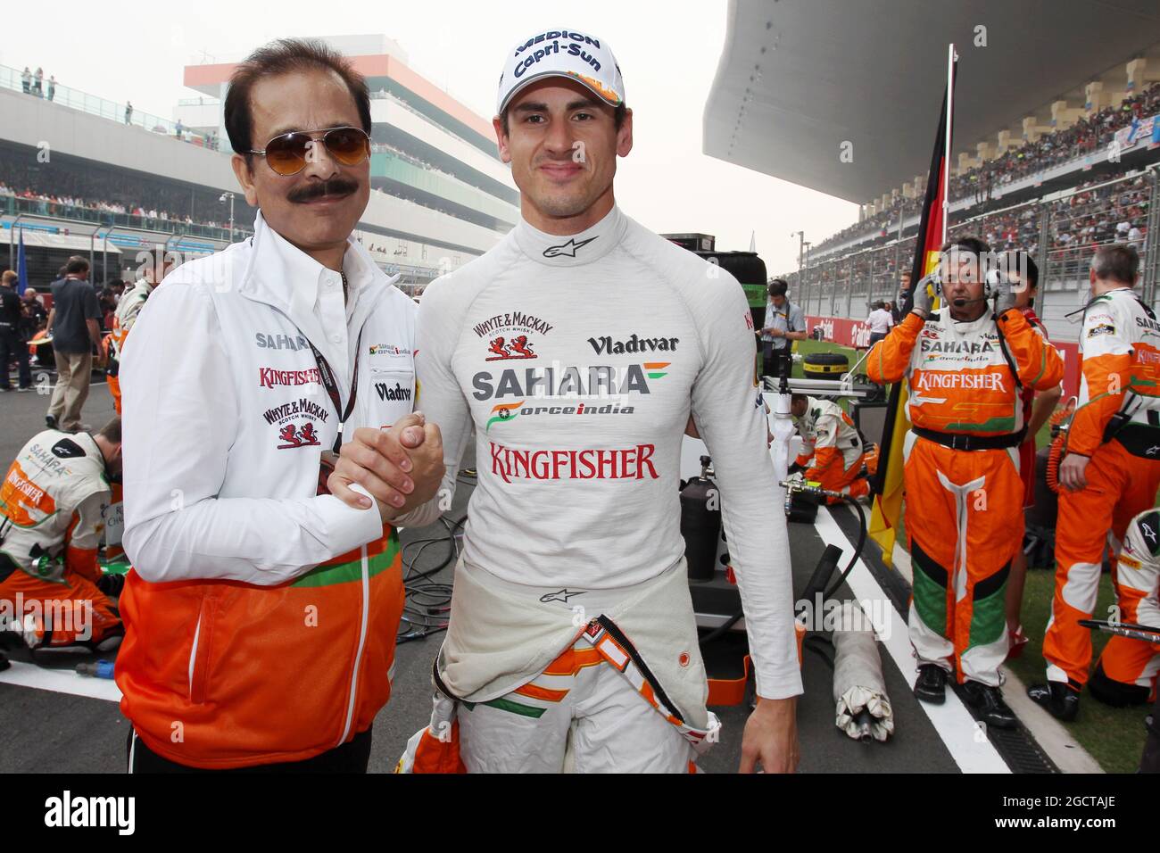 (L to R): Subrata Roy Sahara (IND) Sahara Chairman with Adrian Sutil (GER) Sahara Force India F1 on the grid. Indian Grand Prix, Sunday 27th October 2013. Greater Noida, New Delhi, India. Stock Photo