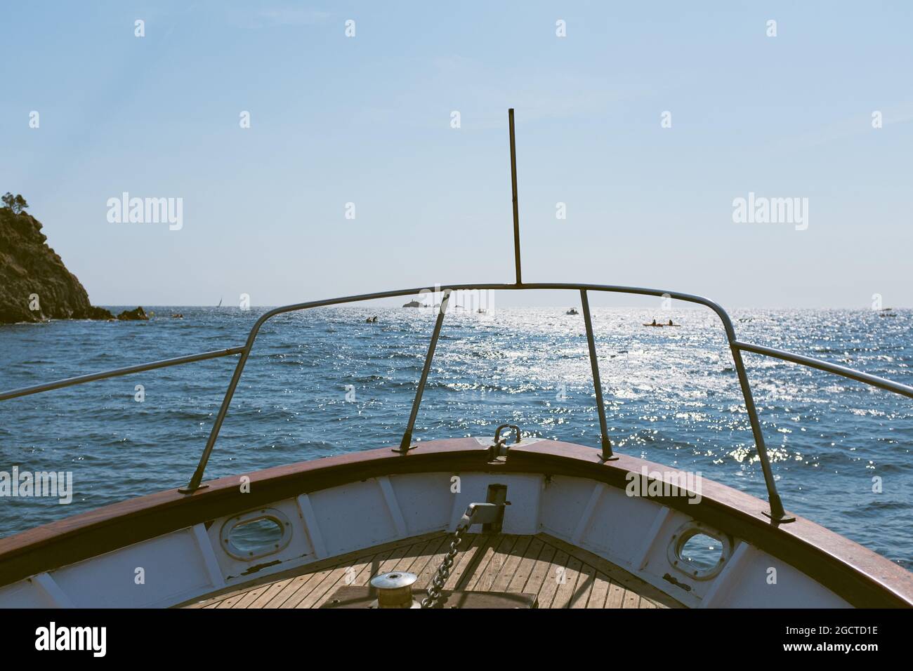 Recreational sailing boat heading to the bright Mediterranean Sea on a blue summer holiday sunny day Stock Photo