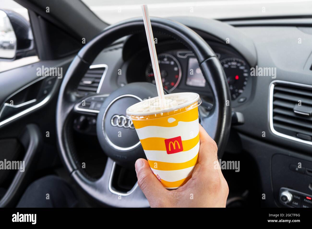 SanktPetersburg, Russia, August 9, 2021 Driver hand holding McDonalds