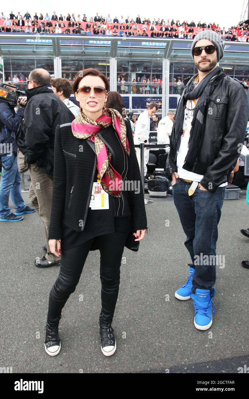 Dannii Minogue (AUS) with boyfriend Adrian Newman on the grid