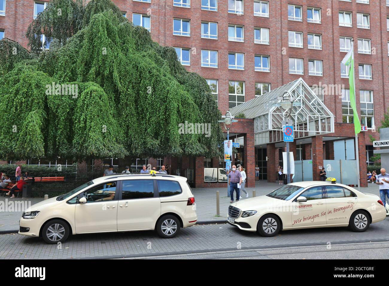 DORTMUND, GERMANY - SEPTEMBER 16, 2020: Taxi cabs parked in front of Klinikum Dortmund hospital in Germany. It is a municipal general hospital for Dor Stock Photo