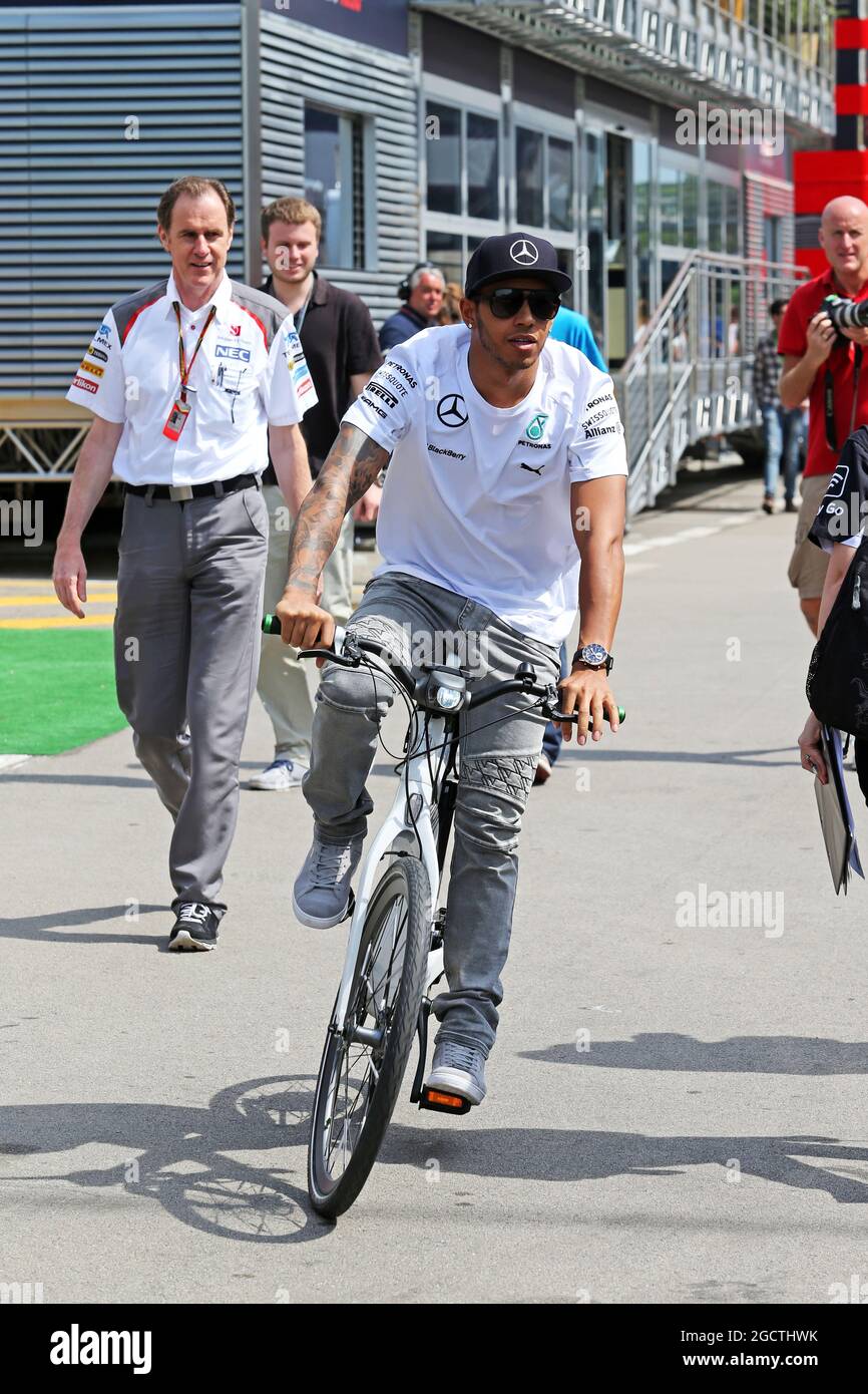 Mercedes amg f1 on his bicycle in paddock hi res stock photography