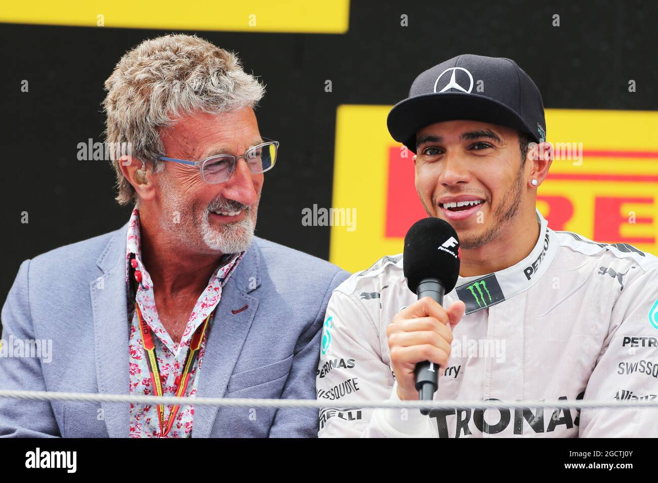 The podium (L to R): Eddie Jordan (IRE) BBC Television Pundit with race winner Lewis Hamilton (GBR) Mercedes AMG F1. Spanish Grand Prix, Sunday 11th May 2014. Barcelona, Spain. Stock Photo