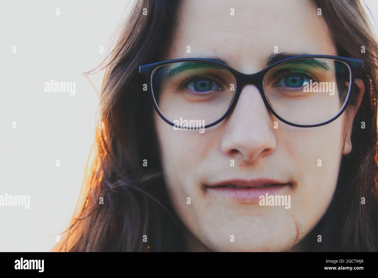 Portrait of a pretty young woman wearing prescription glasses. Stock Photo