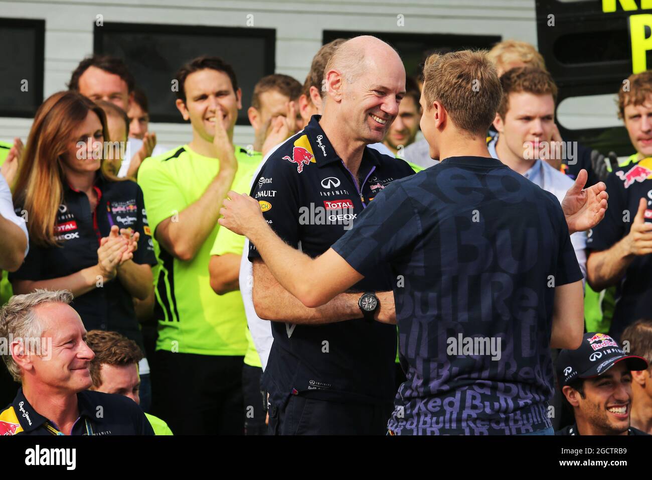 Sebastian Vettel (GER) Red Bull Racing talks with Adrian Newey (GBR) Red Bull Racing Chief Technical Officer as the team celebrate victory for Daniel Ricciardo (AUS) Red Bull Racing. Hungarian Grand Prix, Sunday 27th July 2014. Budapest, Hungary. Stock Photo