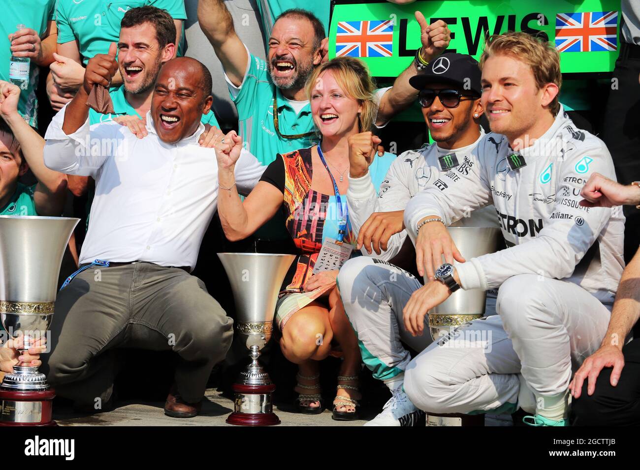 Race winner Lewis Hamilton (GBR) Mercedes AMG F1 celebrates with his step mother Linda Hamilton, father Anthony Hamilton (GBR), team mate Nico Rosberg (GER) Mercedes AMG F1, and the team. Italian Grand Prix, Sunday 7th September 2014. Monza Italy. Stock Photo