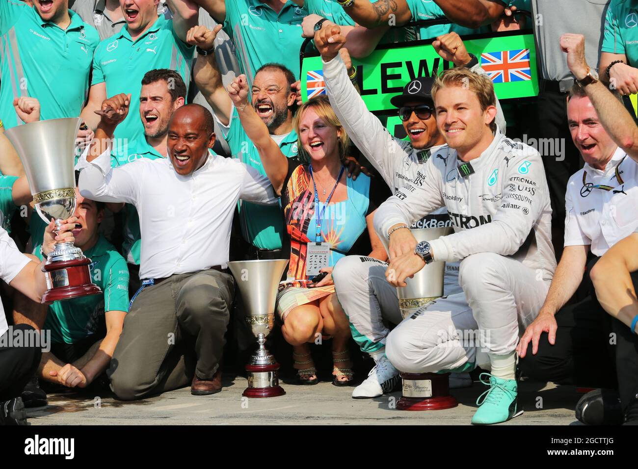 Race winner Lewis Hamilton (GBR) Mercedes AMG F1 celebrates with his step mother Linda Hamilton, father Anthony Hamilton (GBR), team mate Nico Rosberg (GER) Mercedes AMG F1, and the team. Italian Grand Prix, Sunday 7th September 2014. Monza Italy. Stock Photo
